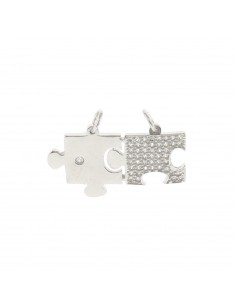 Ciondolo divisibile puzzle con tessera con punto luce e tessera a pavè di zirconi bianchi in argento 925 placcato oro bianco